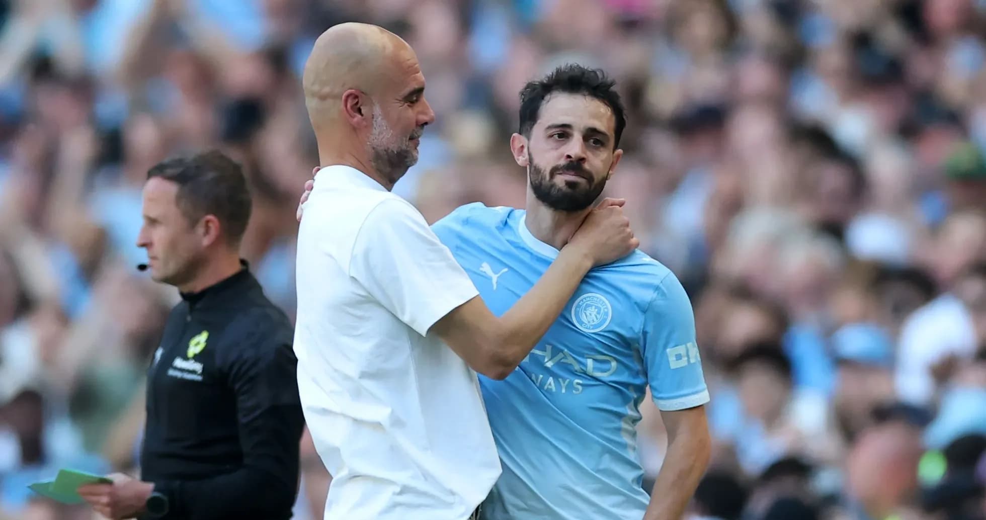 Pep Guardiola embracing Bernardo Silva on pitch